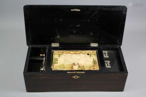 A 19th Century Swiss-made Rosewood Musical Box; the box having brass inlay and plays eight 