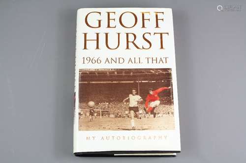 A Black and White Signed Football Photograph of Sir Geoff Hurst, England Striker together with a signed copy of his Autobiography World Cup 66 and a two sheets of stamps depicting Sir Geoff Hurst and his moment of triumph