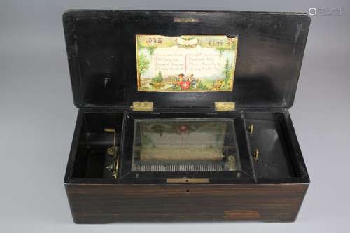 A Victorian Swiss Music Box, the cylinder plays eight melodies, including Home Sweet Home, Auld Lang Syne, Pirates of Penzance, The Blue Bells of Scotland, Campbell's are coming, Sweethearts Waltz, Bonnie Prince Charlie and Coming thro the Rye, complete with a rosewood case