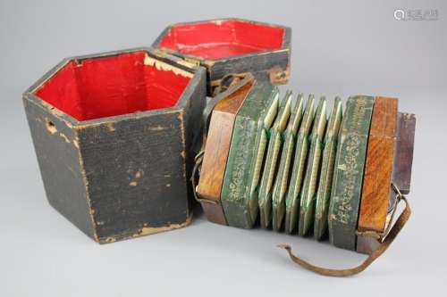 An Antique German Rosewood Concertina; the concertina in the original box