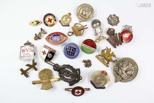 Miscellaneous Military and Nursing Badges, including Royal Army Medical Corps, National Union of Women's Suffrage enamel pin, British Red Cross Society, Wycombe Abbey School Badge x 2, Women for the Forces Badge, Civil Defense badge, Red Cross and St John badges etc