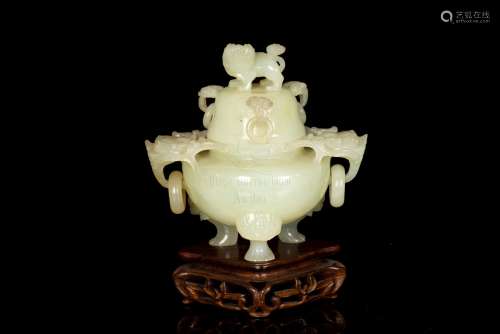 A FINE CELADON JADE CENSER AND COVER WITH CARVING OF LIONS