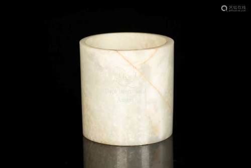 A FINE AND LARGE CELADON JADE BRUSHPOT/RING WITH RUSSET STREAKS