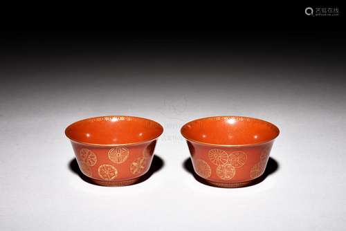 PAIR OF GILT AND RED GROUND 'FLOWERS' CUPS