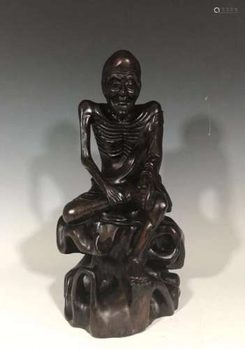 A fine carved of a hard wood figure Lohan