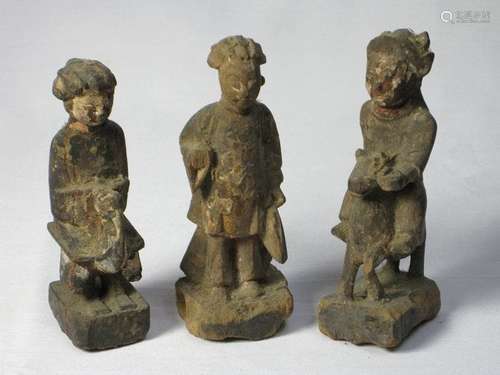 A group of three carved wood figures of Buddha, Qing