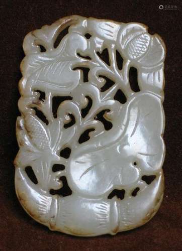 a grey white jade pendant