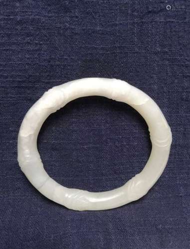 A white jade in a bamboo from bangle