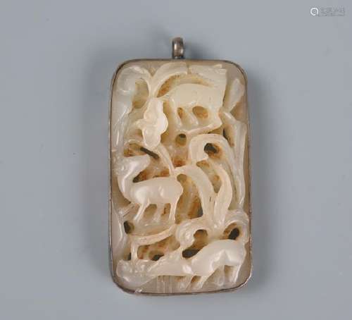 A carved white pendant