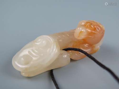 A carved white pendant