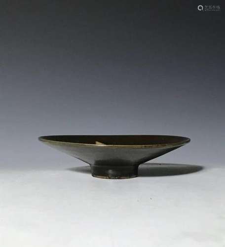 A black glazed tea bowl