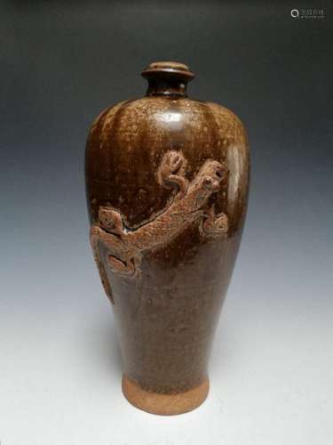 A sung mai ping in a brown glazed with a baby dragon