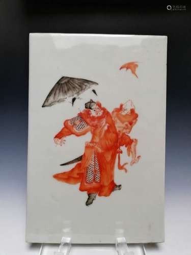 An iron red painted a figure of chong cai  in porcelain