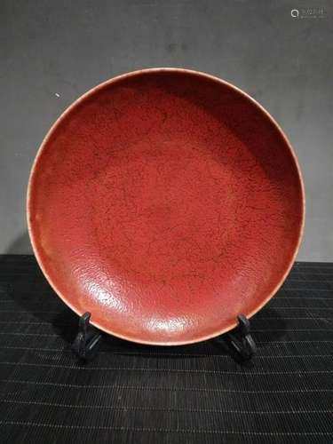 A RARE CHINESE MONOCHROME GLAZED RED PLATE