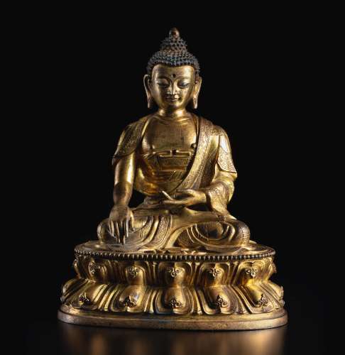 A GILT-BRONZE FIGURE OF SHAKYAMUNI 17TH CENTURY 