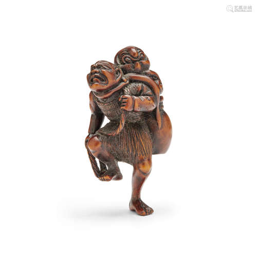 Edo period (1615-1868), 19th century A wood netsuke of a fisherman and octopus