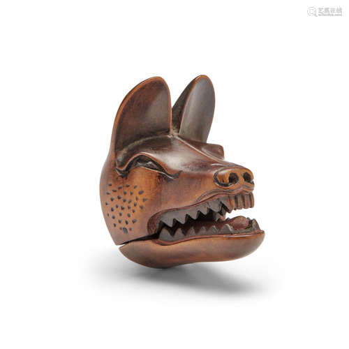 A wood mask netsuke of kitsune (fox)Edo period (1615-1868), early 19th century Deme Uman (active early 19th century)