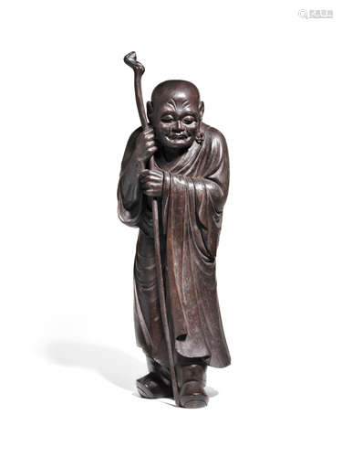 A carved wood statue of a Rakan (Arhat)Taisho era (1912-1926), dated 1920 Kano Tessai (1845-1925)