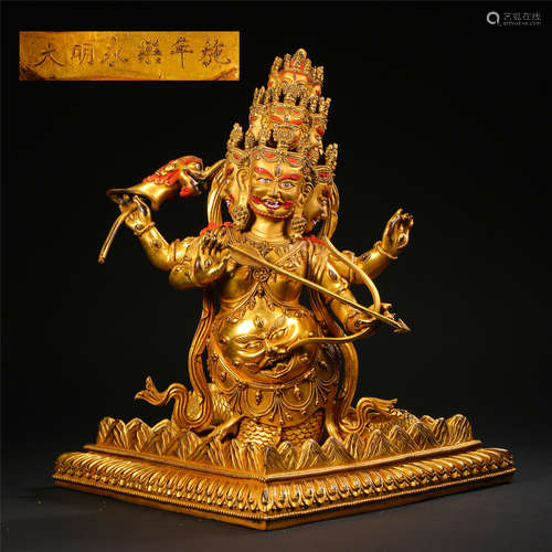 TIBETAN GILT BRONZE SEATED BUDDHIST GUARDIAN