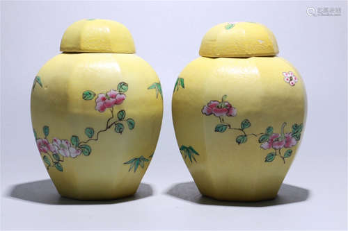 PAIR OF CHINESE PORCELAIN YELLOW GLAZE FAMILLE ROSE LIDDED JARS