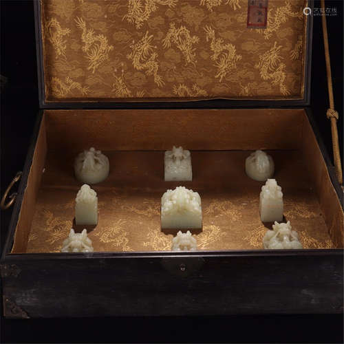 NINE CHINESE WHITE JADE DRAGON SEALS IN ROSEWOOD CASE