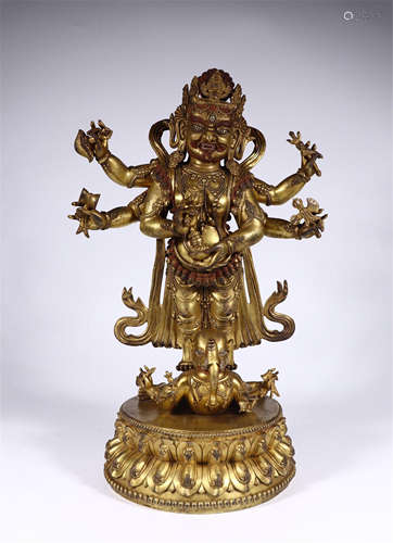 TIBETAN GILT BRONZE STANDING SIX ARM BUDDHIST GUARDIAN