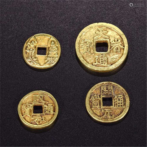 FOUR CHINESE GILT SILVER COINS