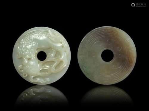 Two Jade Bi-Form Pendants Larger: diam 2 1/4 in., 6 cm.