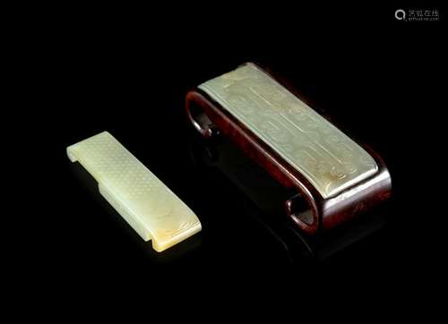 Two White Jade Sword Slides Larger: 3 1/4 in., 8 cm.