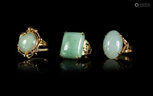 Three Jadeite and 14K Yellow Gold Mounted Rings Largest