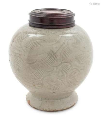 A Celadon Glazed Porcelain Incised Jar Height 4 3/4