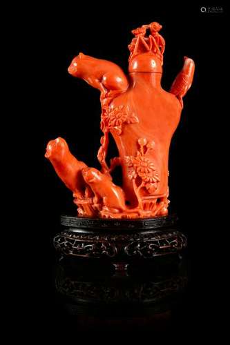 A Carved Red Coral Snuff Bottle Height 3 1/4 in., 8 cm.