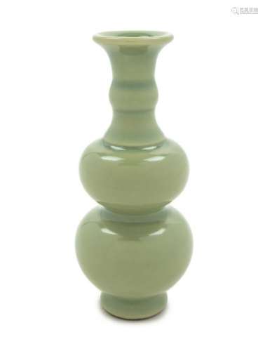 A Small Celadon Glazed Porcelain Gourd-Form Vase Height