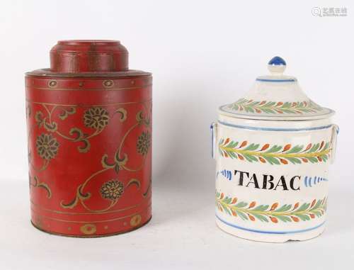 Deux grands pots à tabac, l'un en tôle polychrome,…