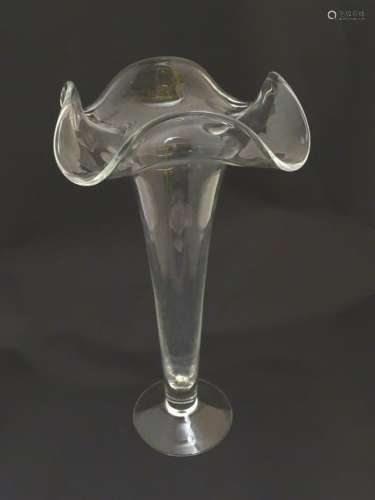 Glass vase: a tall 20thC lily, pedestal vase of clear