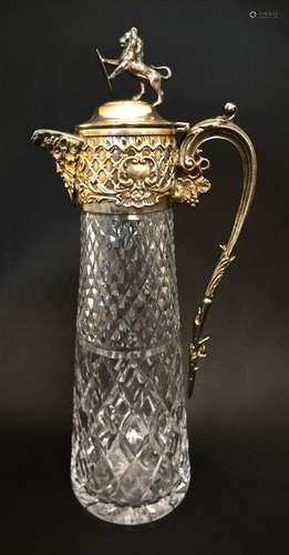 Glass : a claret jug with silver plate top and hinged