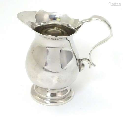 A  Victorian small silver cream jug hallmarked