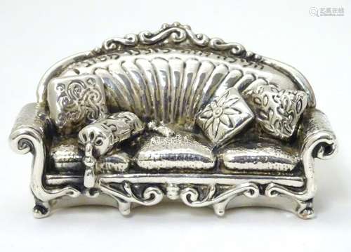 A miniature silver model of a sofa marked .925. 3''