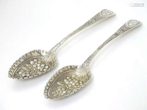 A matched pair of silver berry spoons, hallmarked