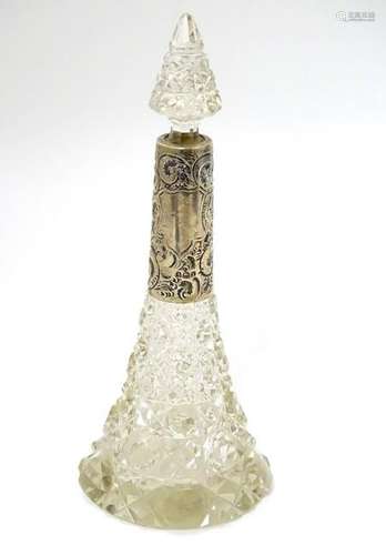 A cut glass scent flask / perfume bottle with silver