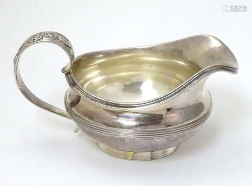 A silver jug hallmarked London 1826 maker William