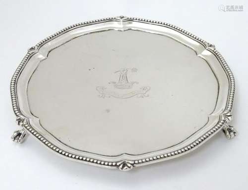 A silver visiting card tray with beaded rim and