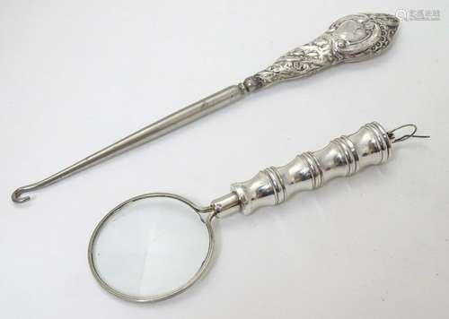 A magnifying glass 4 1/2'' long overall together with a