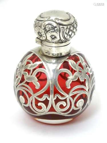 A cranberry glass scent bottle / flask with silver