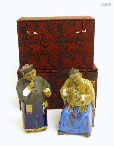 Two ceramic figures of Chinese men in traditional dress