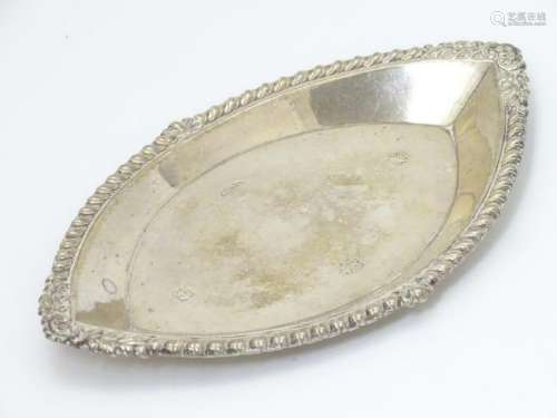 A silver pin dish of lozenge form with gardrooned