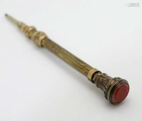 A gilt metal propelling pencil with hardstone to seal