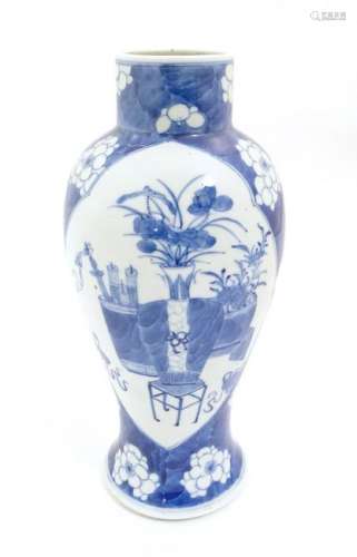 A Chinese blue and white baluster vase decorated with