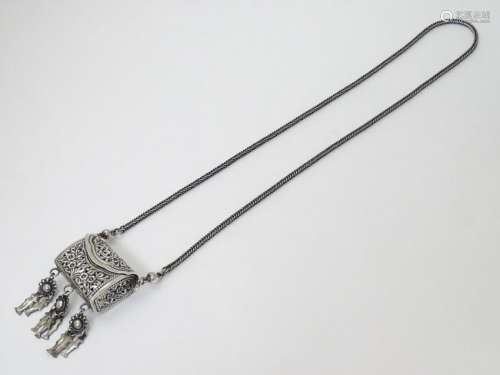 A white metal pendant pomander of purse form with