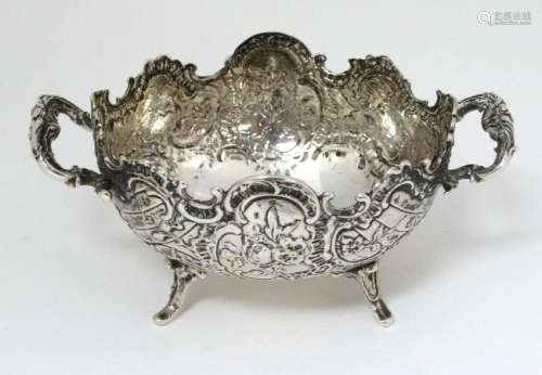 A Continental white metal twin handled dish,